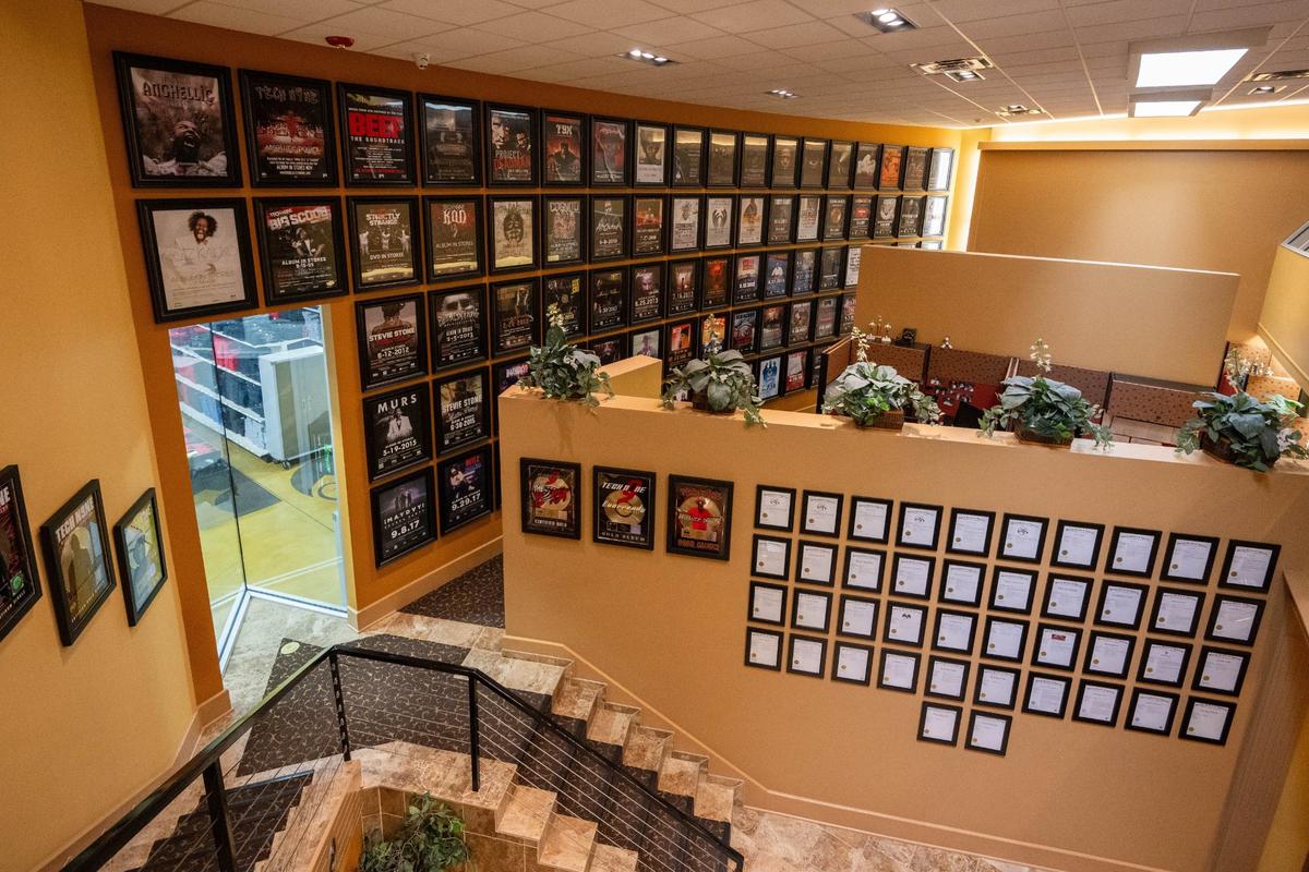 This room features a floor to ceiling poster display that is alphabetized and also a wall that features every trademark that Strange Music currently holds.