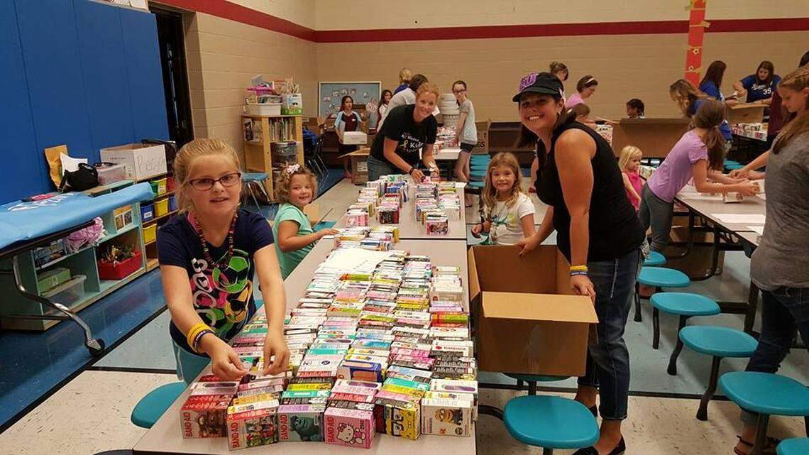 Volunteers sort the boxes of bandages during one of the past bandage drives.