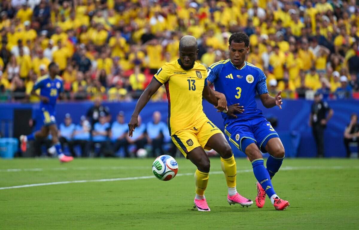 Ecuador forward Enner Valencia (13) battles for the ball against Curaçao defender Juriën Gaari (3) in the Ecuador vs. Curaçao FIFA World Cup group-stage soccer match at Kansas City (Arrowhead) Stadium in Kansas City on Saturday, June 20, 2026.Ecuador vs. Curaçao FIFA World Cup group-stage soccer match at Kansas City (Arrowhead) Stadium in Kansas City on Saturday, June 20, 2026.