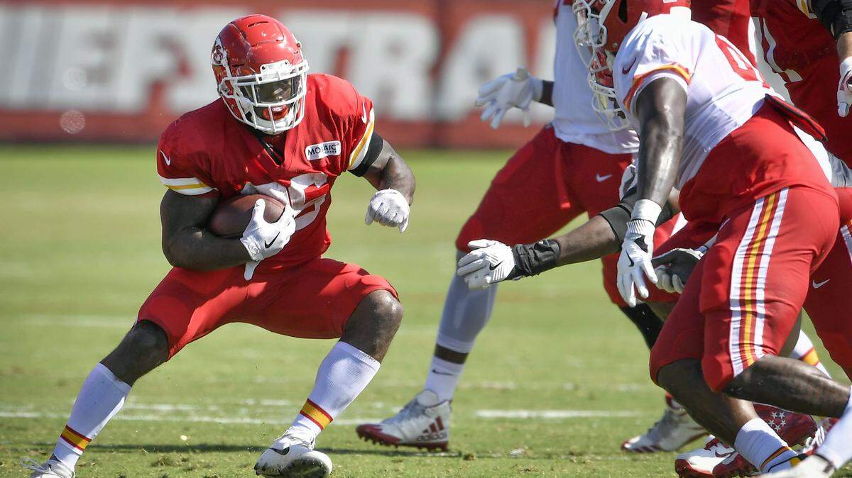Chiefs running back Damien Williams, left, makes a cut in front of defensive tackle Jarvis Jenkins during a recent training camp practice in St. Joe.