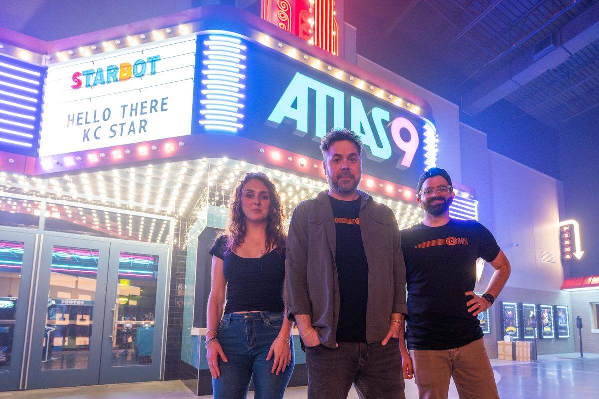 Part of the design team from Dimensional Innovations, inside their newest creation, Atlas 9, on Wednesday, Sep. 3, 2025, in Kansas City, Kansas. The narrative-driven immersive art experience featuring interactive games, videos, and AI-powered experiences, all housed inside a retro movie theater.
