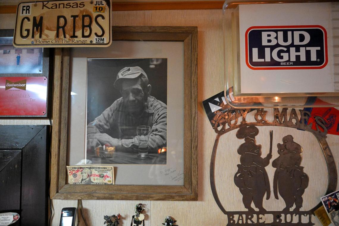 A photo of the late Guy Kesner hangs on the wall with other memorabilia at Guy & Mae’s Tavern. Kesner opened the barbecue joint in 1973 with his wife, Mae. 