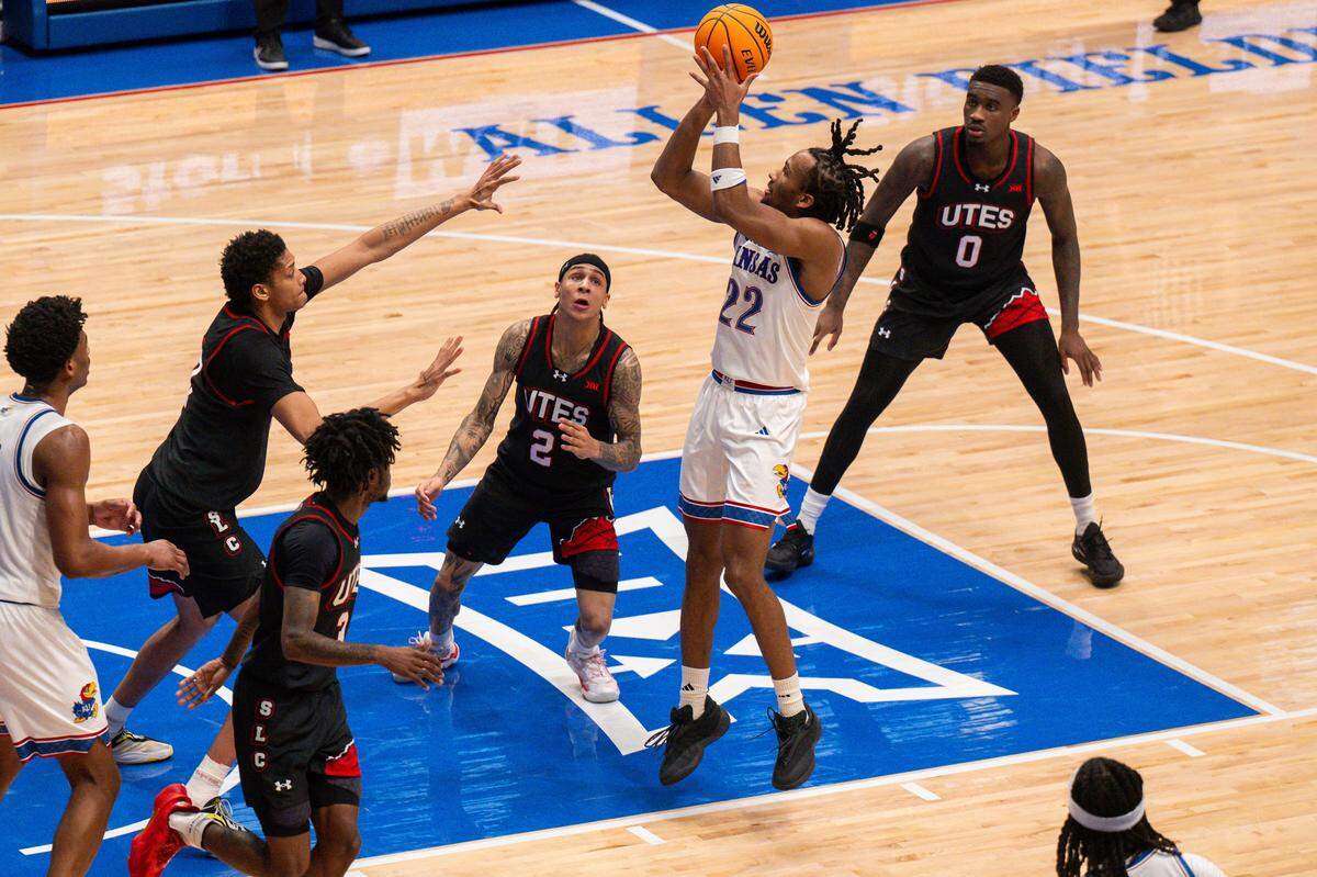 Kansas Jayhawks guard Darryn Peterson (22) takes a jump shot over Utah Utes defenders in the first half on Saturday, February 7, 2026, at Allen Fieldhouse.