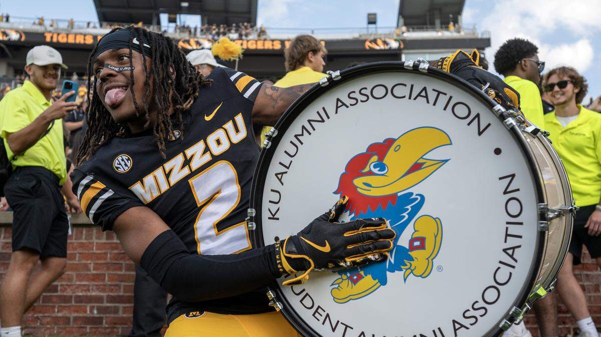 Missouri Tigers wide receiver Marquis Johnson (2) beats a drum featuring the Jayhawk mascot after Missouri's 42-31 win over the Kansas Jayhawks at Faurot Field at Memorial Stadium on Saturday, Sept. 6, 2025, in Columbia.