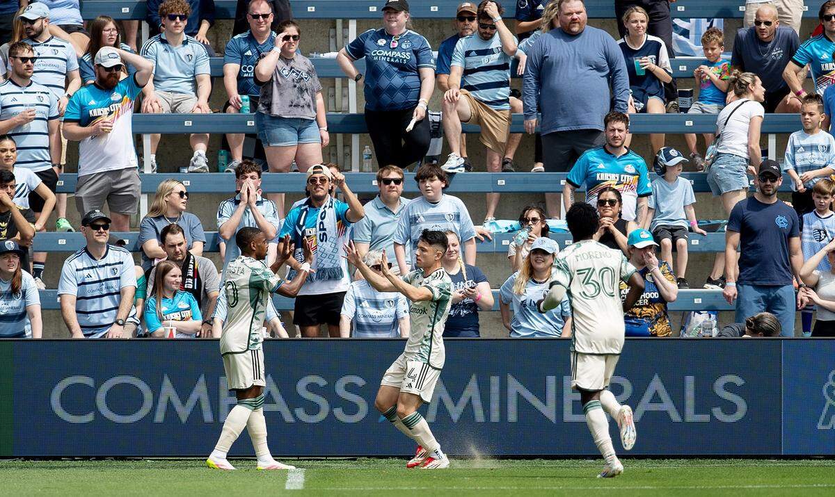 Portland Timbers players celebrate a goal by midfielder David Ayala during a Major League Soccer match against Sporting KC at Children’s Mercy Park in Kansas City, Kan., on Sunday, April 13, 2025.