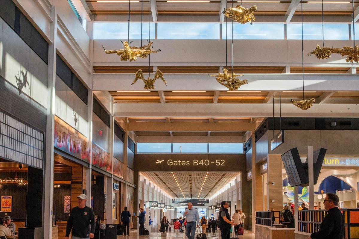 Travelers are greeted by sculptures called “Jazz Birds,” by artist Willie Cole, at Kansas City International Airport on Tuesday, Feb. 28, 2023.