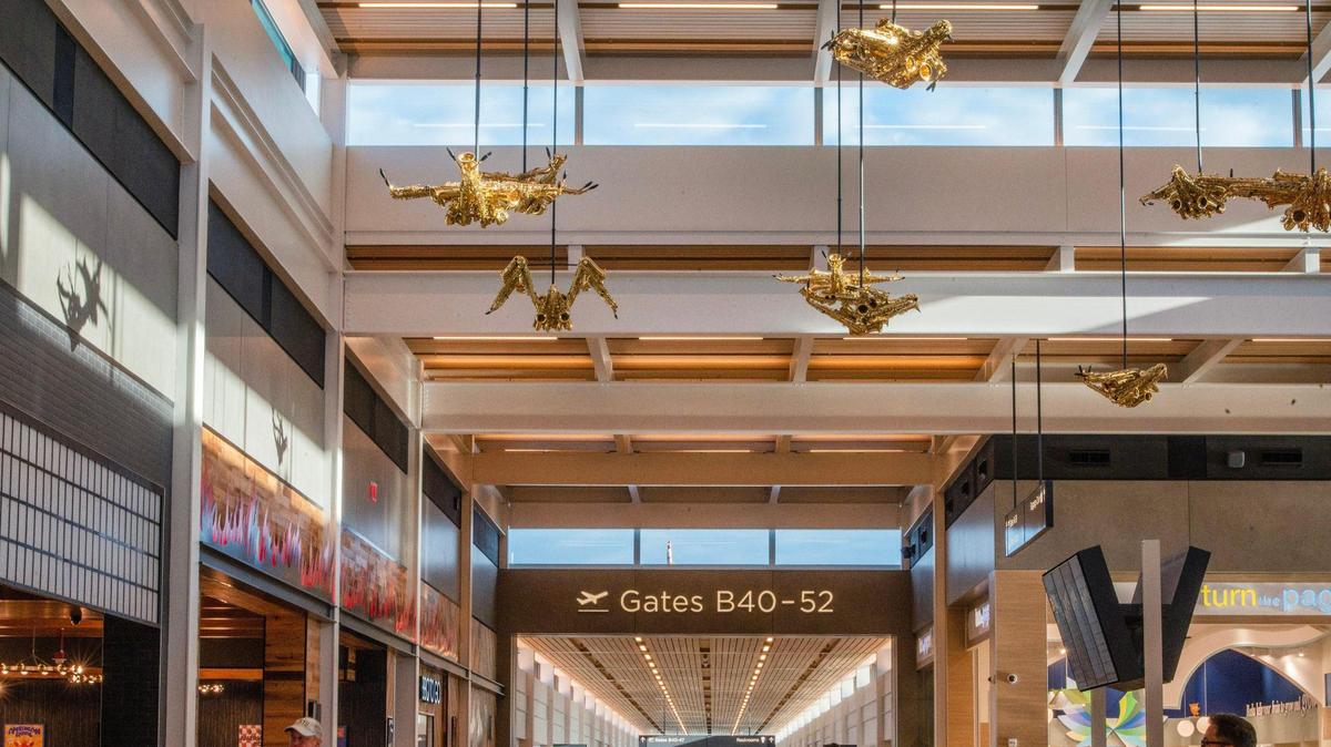 Travelers are greeted by sculptures called “Jazz Birds,” by artist Willie Cole, at Kansas City International Airport on Tuesday, Feb. 28, 2023.