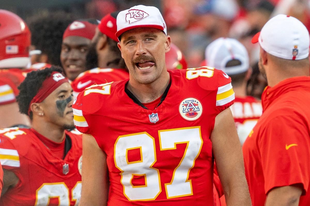 Kansas City Chiefs tight end Travis Kelce (87) licks his lips while standing on the sidelines in the fourth quarter during a game against the Detroit Lions on Saturday. (081724, Arrowhead Stadium)