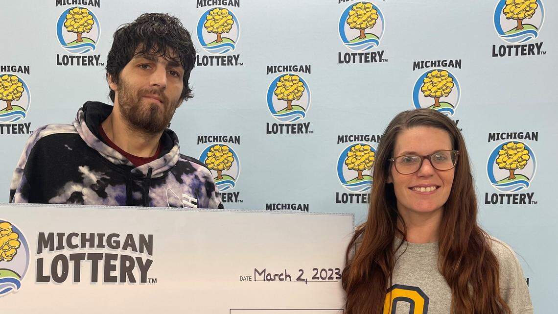 Brandi Chislett-Barnes with her oversized check.