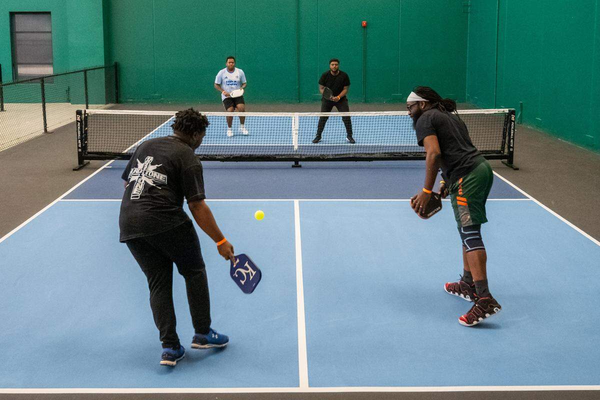 A game in progress during a meeting of the Black Pickleball Club at SW19 at the Stadium, on Sunday, February 22, 2026, in Kansas City. The club, started by Brandan Jackson, hosts weekly meetups every Sunday to help introduce pickleball to the Black community. Beginners to advanced levels and all ages are welcome.