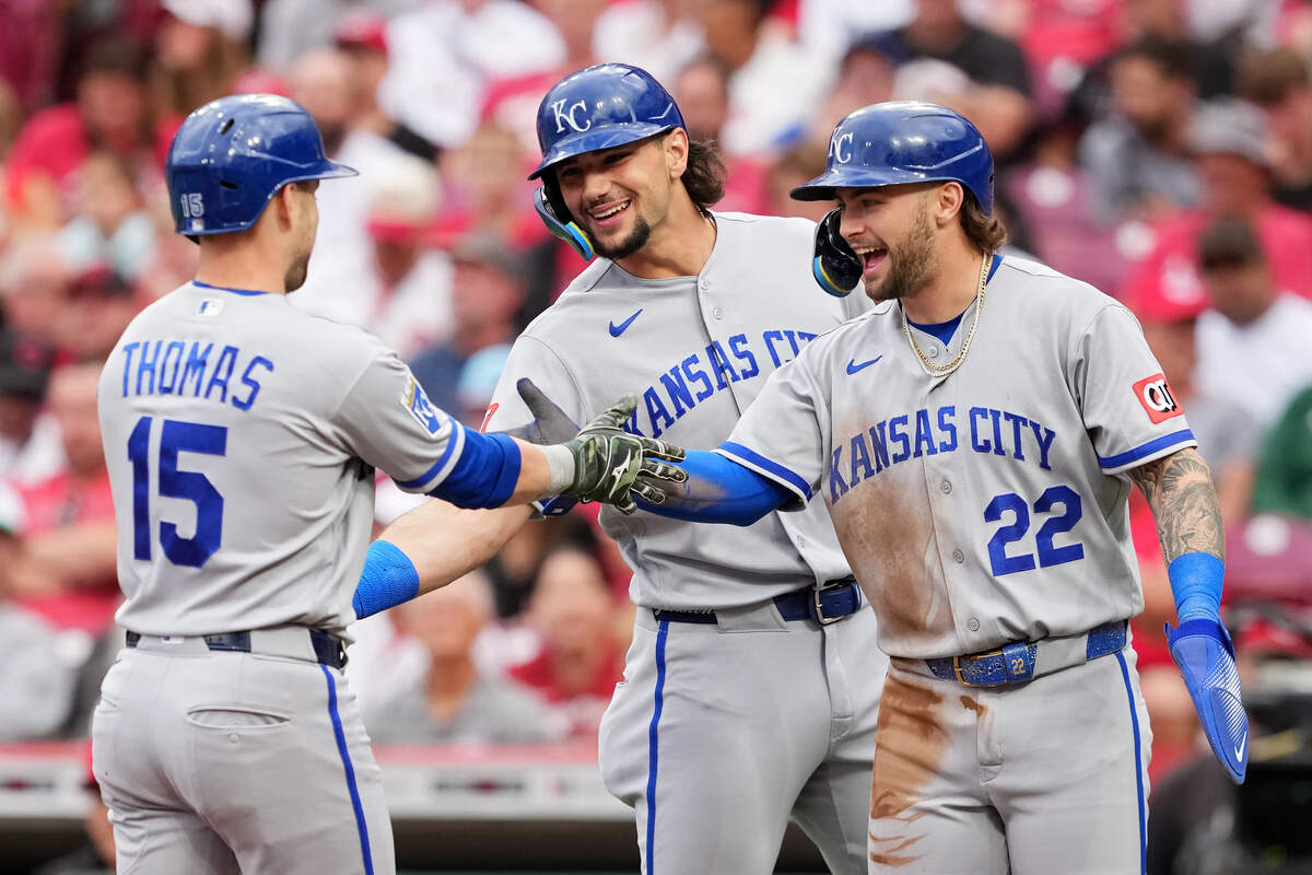 Lane Thomas #15, Jac Caglianone #14, and Carter Jensen #22 of the Kansas City Royals celebrate after Thomas hit a grand slam in the first inning against the Cincinnati Reds at Great American Ball Park on June 1, 2026 in Cincinnati, Ohio.