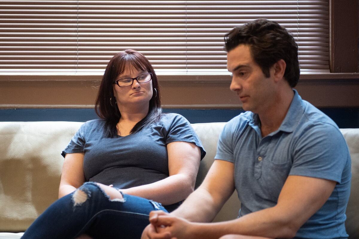 Randi McGaugh and attorney Tom Porto speak in Porto’s Kansas City office on May 30, 2024, after a jury awarded $10 million in a lawsuit filed after McGaugh and Allen Cates were shot by a Jackson County deputy in 2019. Cates was killed in the shooting, and McGaugh was injured.