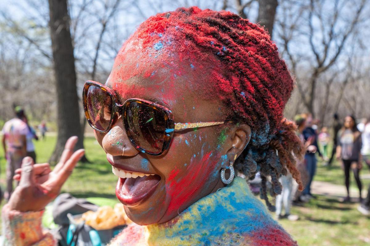 Salama Otto smiles after getting Holi colors put on her head at a Holi Festival of Colors in Overland Park on Sunday.