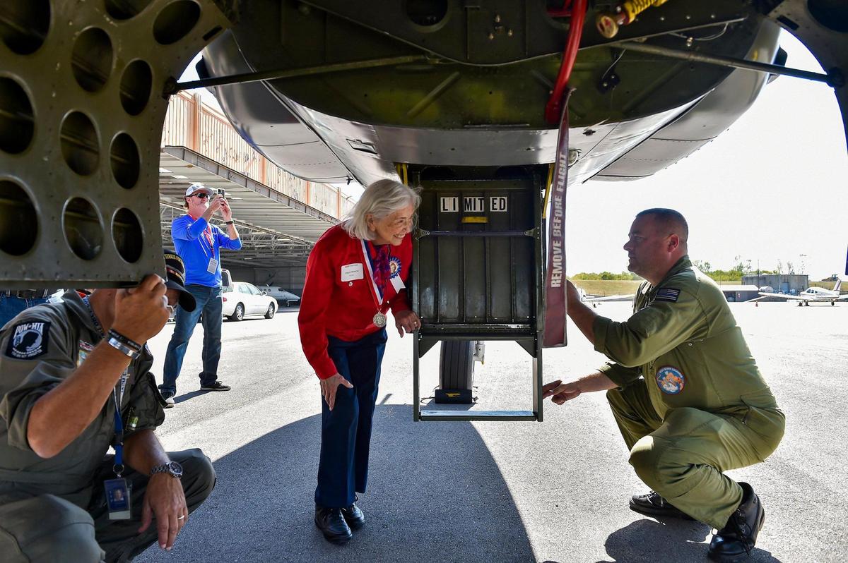 Freda Renick of Lee’s Summit, left, talks with Tim Peterson, a member of the B-25 flight crew with the Yankee Air Museum in Belleville, Michigan, before climbing up and looking inside. Renick, 97, helped build the plane, Rosie’s Reply, a B-25D bomber built at the North American Aviation plant in Fairfax. It arrived at Charles B. Wheeler Downtown Airport Monday, Oct. 4, 2021, the first time it has been back to Kansas City, Kansas, since it flew out for World War II. Rosie’s Reply is scheduled to fly over the Fairfax Festival Oct. 7.