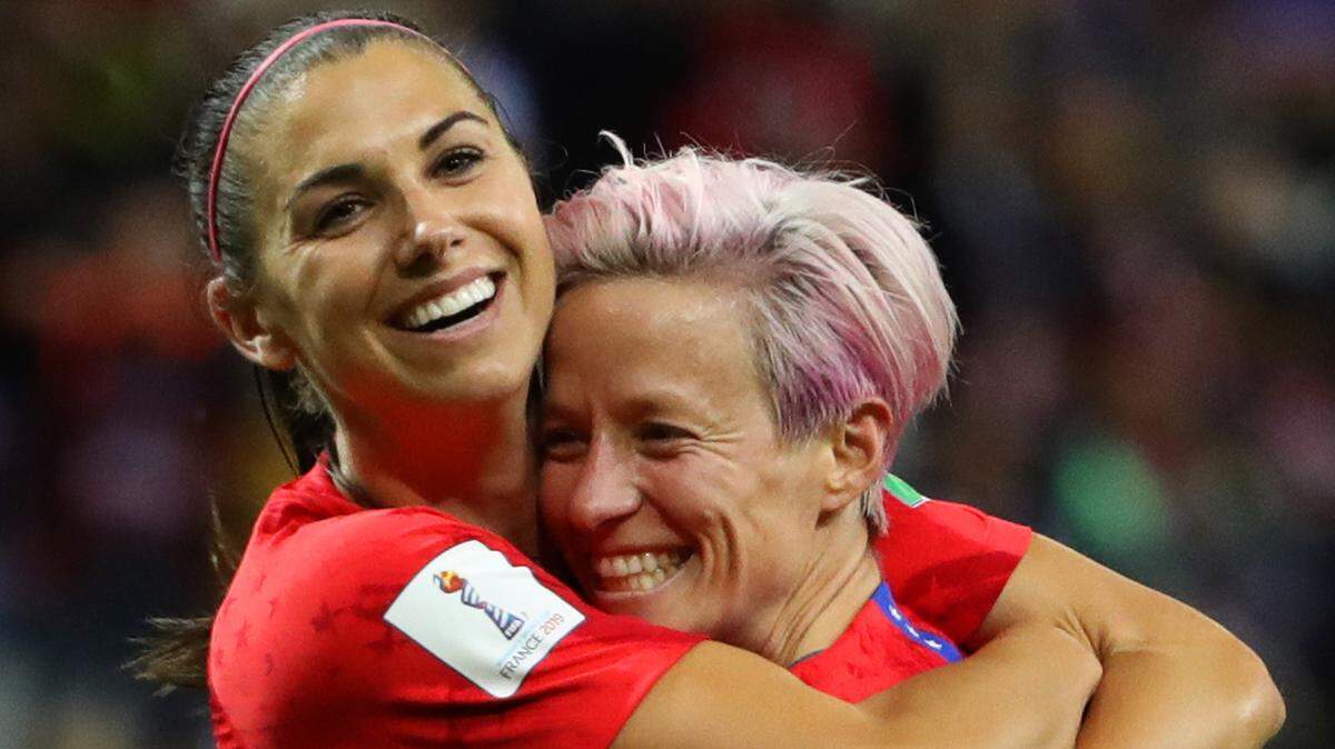 Alex Morgan hugs USWNT teammate Megan Rapinoe during a match in 2019. The U.S. Women’s National Team will play Nigeria in Kansas City in September.
