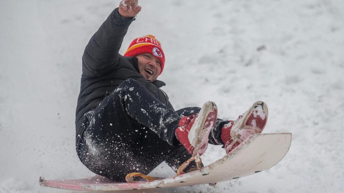 Abraham Tellez sleds down a hill at Hyde Park in Kansas City on Tuesday, Jan. 9, 2024.