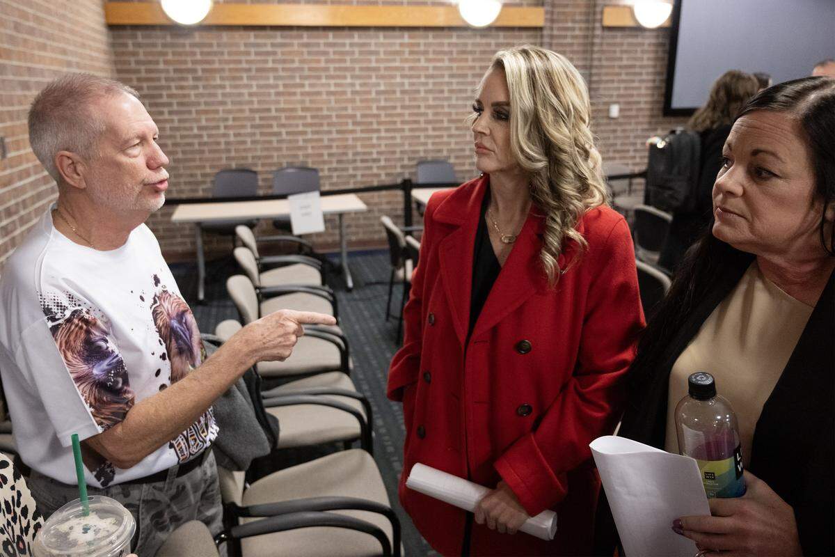 Primate expert Dana Savorelli (left) of Monkey Island Rescue and Sanctuary in Greenwood, Missouri, speaks with Prairie Village resident Toni Skelton and her supporter Lacy Moore following a City Council vote on Monday, Jan. 5, 2025. While the council's new exotic pet ordinance allows Skelton to keep her spider monkey, Skelton expressed frustration over new restrictions, which include a ban on taking the animal into public spaces.