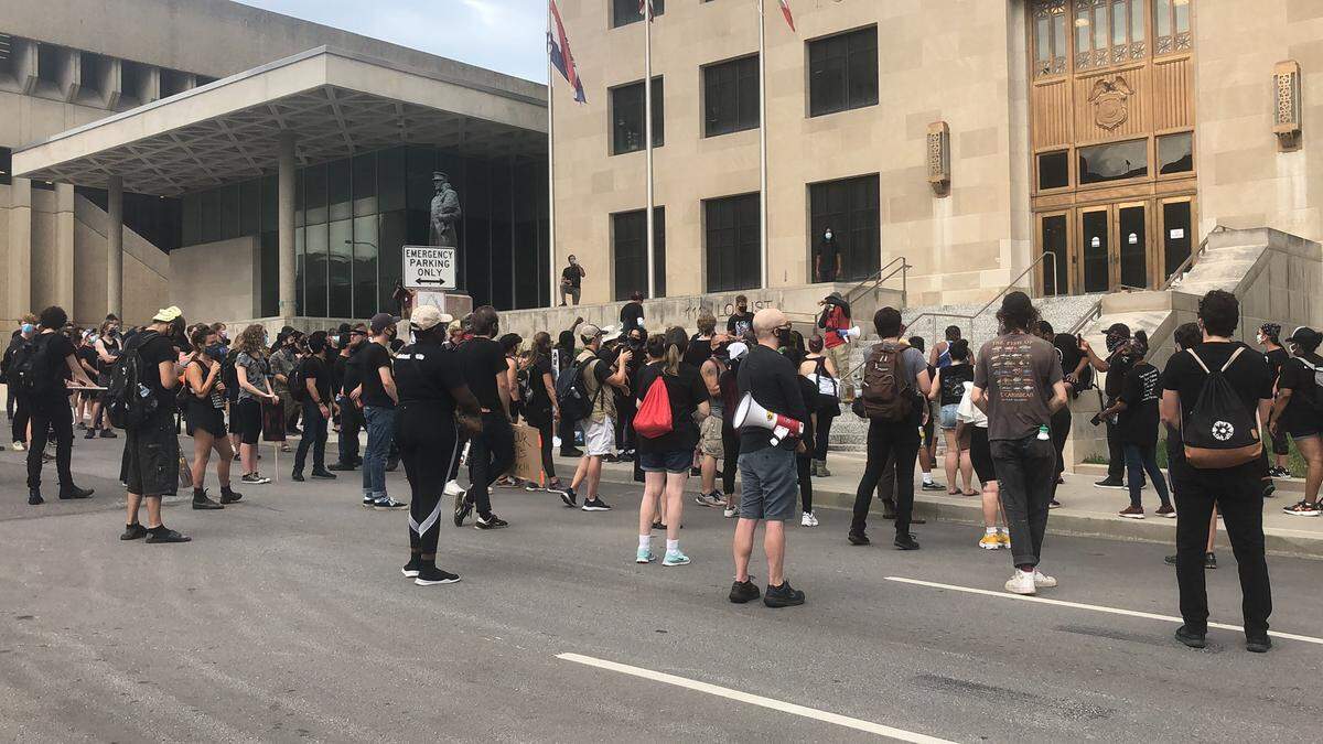 Outside Kansas City Police Department headquarters a crowd gathered to protest Operation Legend, an initiative that will send over 200 federal law enforcement agents into Kansas City.