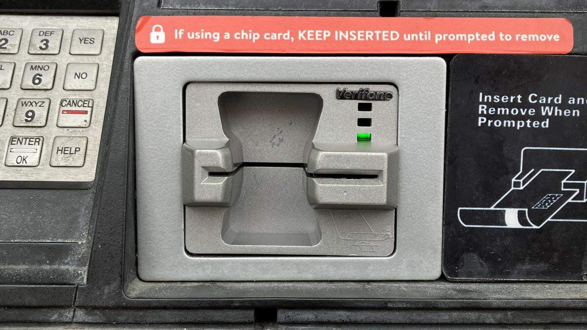 A point-of-sale station with a card skimmer installed over the card reader is seen in this photo from the Blue Springs police department.