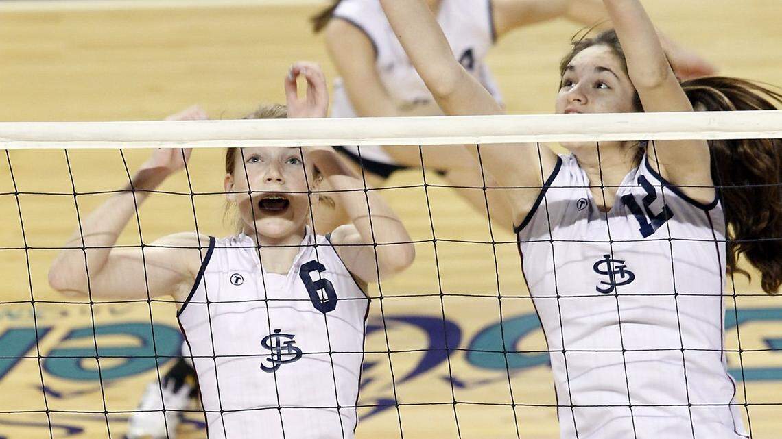They’ve been unstoppable since their days as teammates at St. James Academy: Jenna Gray, left, and Audriana Fitzmorris go up for a block against Shawnee Heights during the 2012 Kansas state high school finals in Topeka.