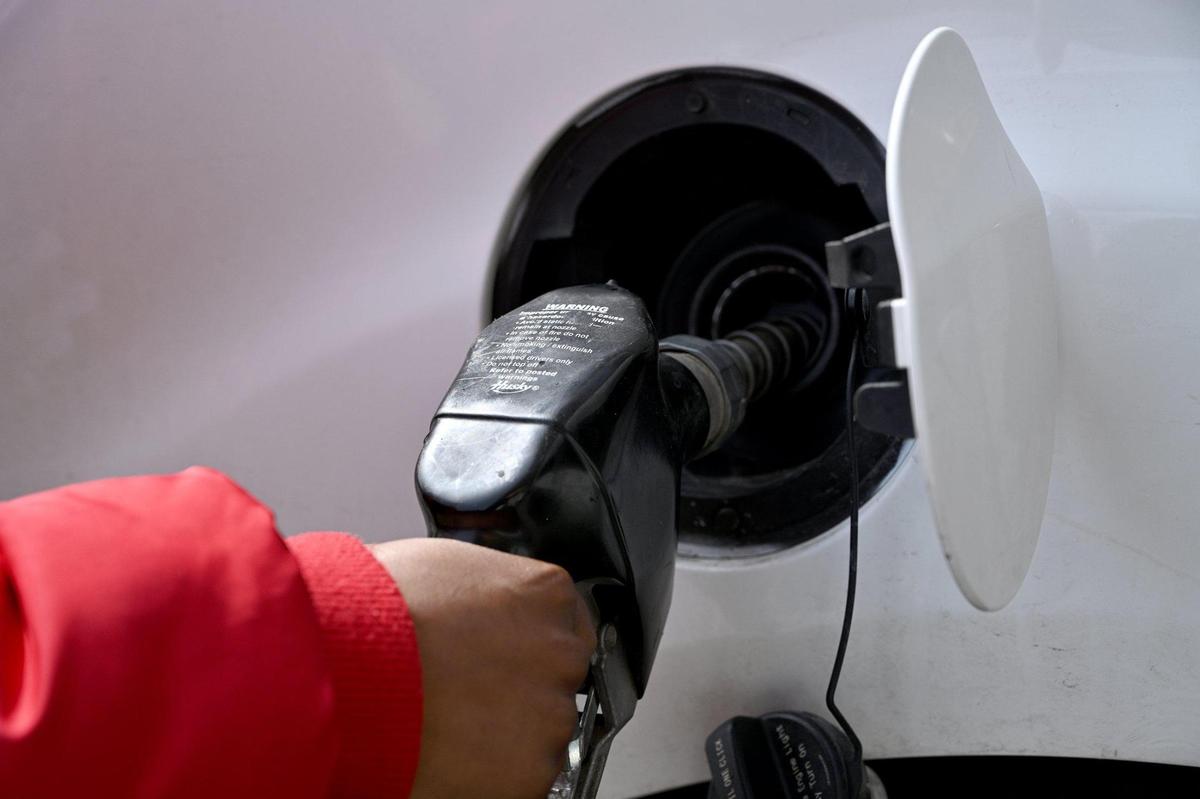 Jahmeca Harker of Kansas City pumped gas at the Shell station at Main Street and E. 38th Street Kansas City Tuesday, Mar. 8, 2022.