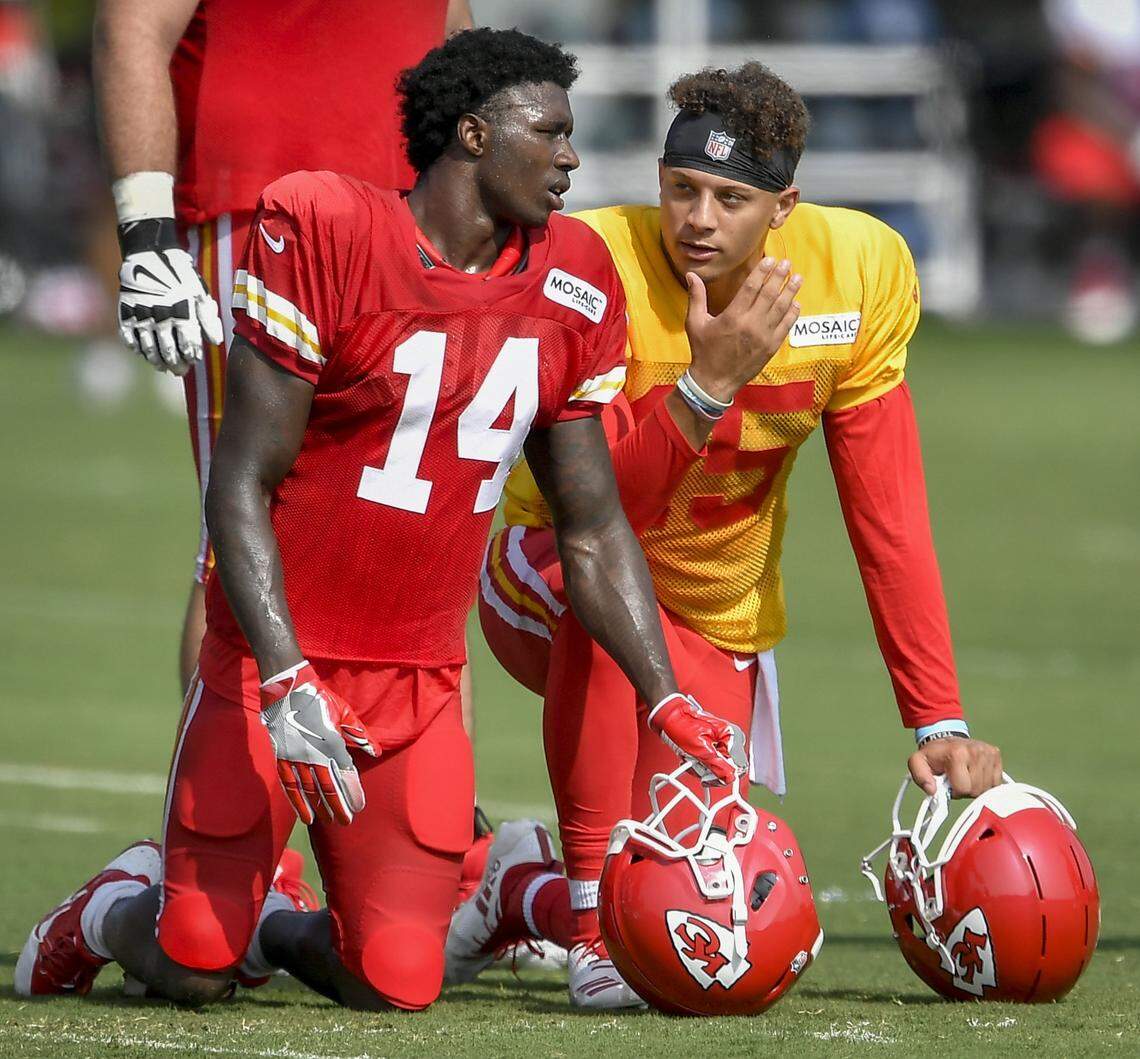 Chiefs wide receiver Sammy Watkins (left) and quarterback Patrick Mahomes talk on the sidelines during training camp.