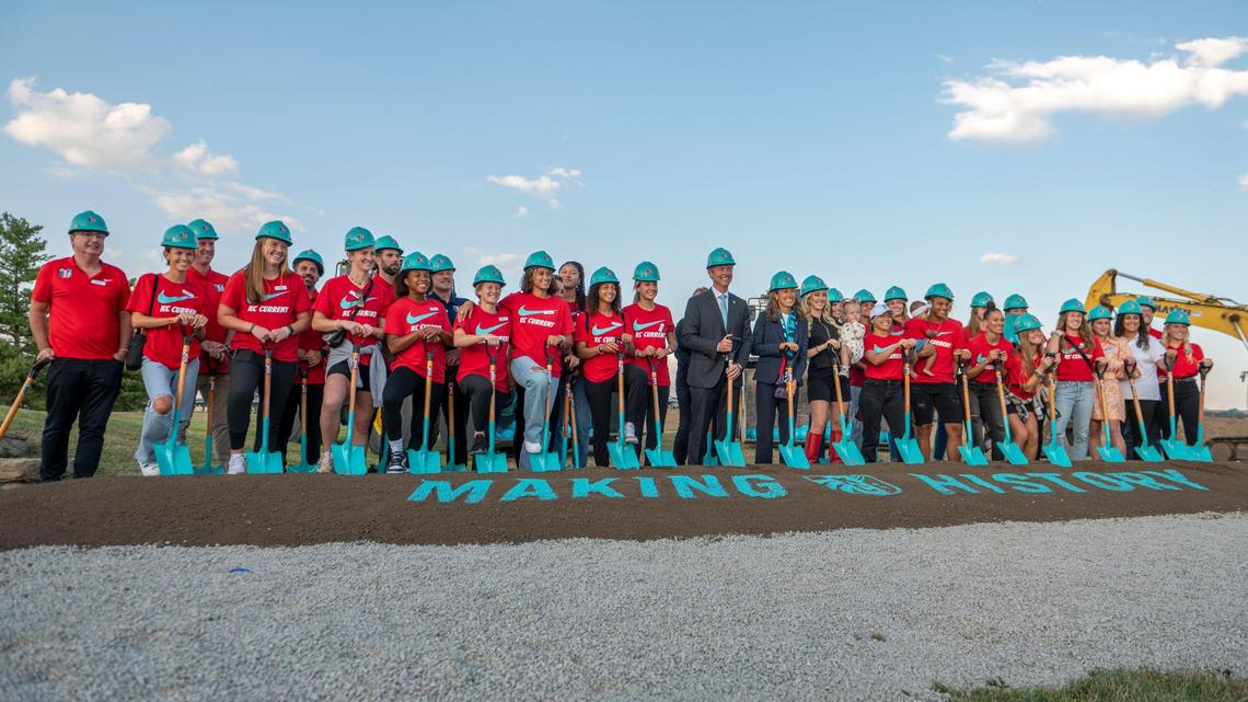 KC Current team members pose for a photo during the groundbreaking ceremony for KC Current stadium at Berkley Riverfront on Thursday, Oct. 6, 2022, in Kansas City.