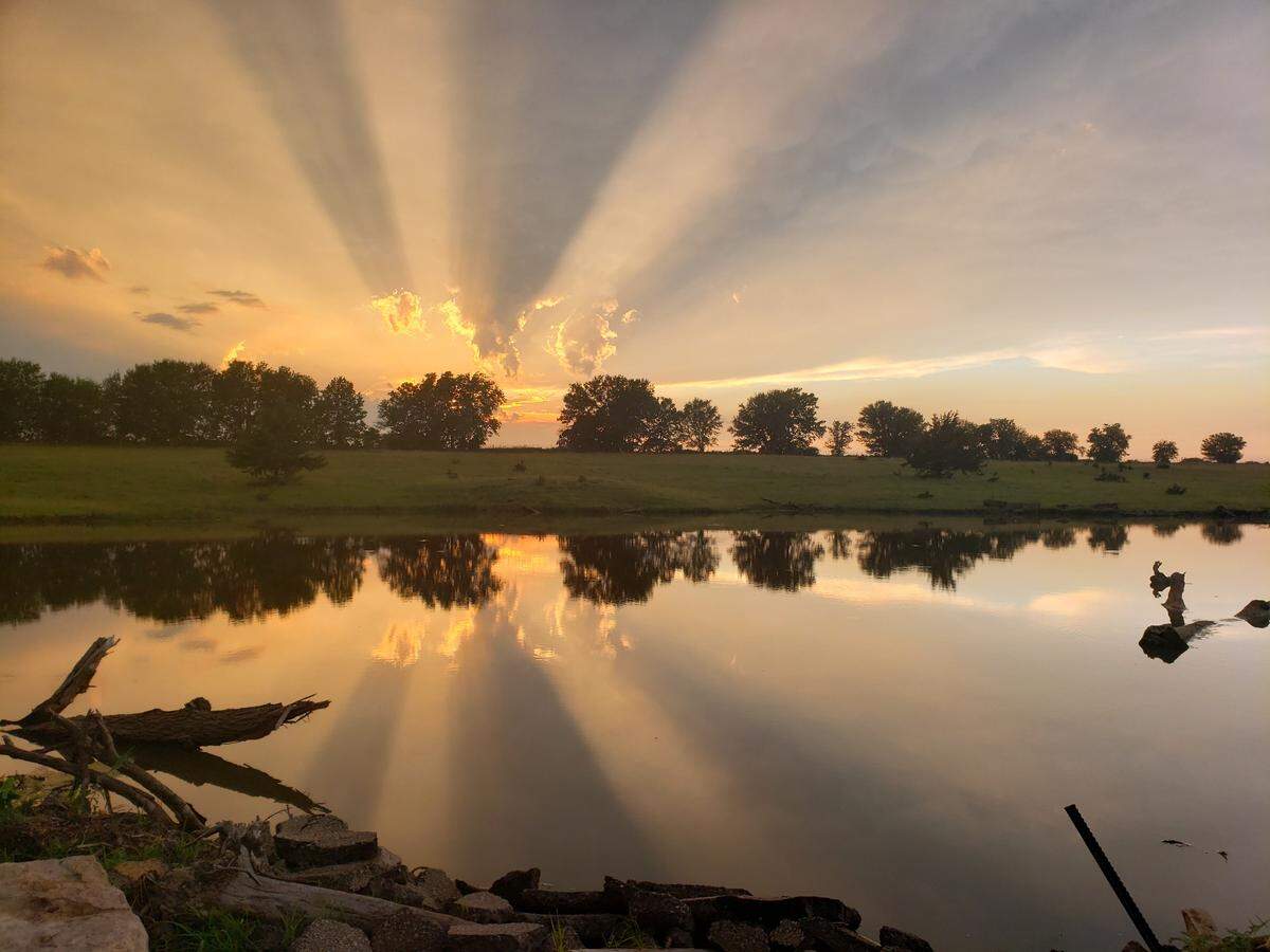 This is of a sunset taken over one of the ponds in our pasture last summer in the Flint Hills. Kansas is a quiet beauty, a steady beauty, one driven by longevity. It isn’t fast, flashy, something everyone can see, but those of us lucky to experience that beauty will never forget it.
