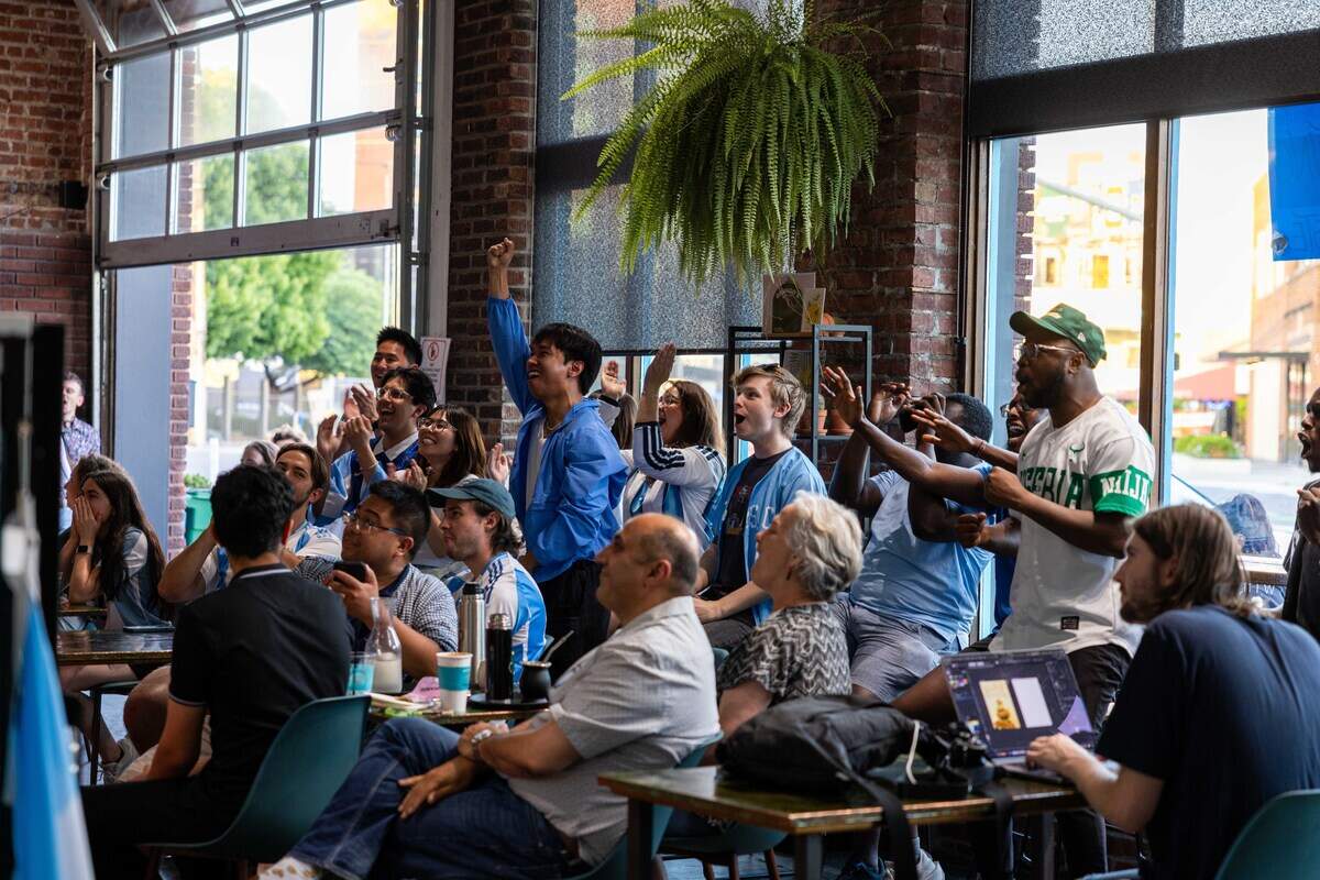Fans at Café Corazón on Southwest Boulevard react to a play during a watch party for the World Cup game between Algeria and Argentina, which was held in Kansas City, on Tuesday, June 16, 2026.