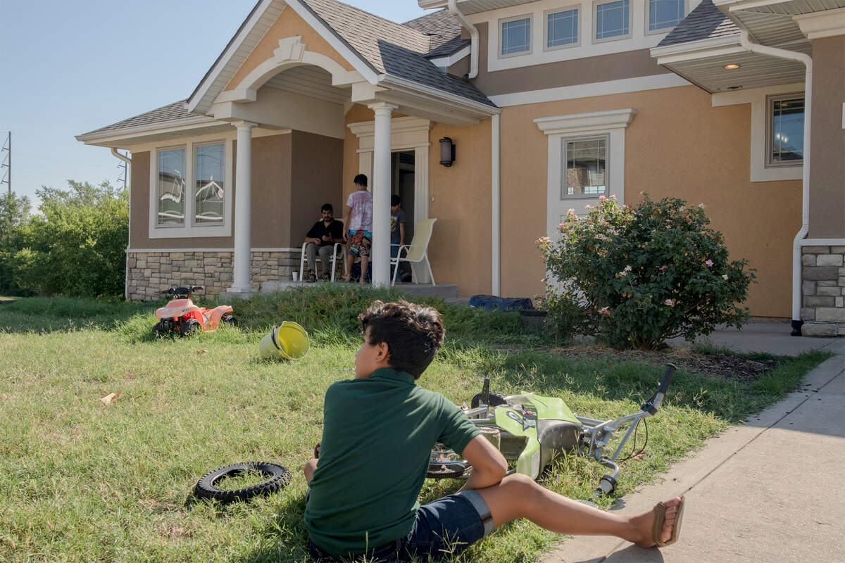 Rezwan’s younger brother outside the family’s home in southwestern Missouri.