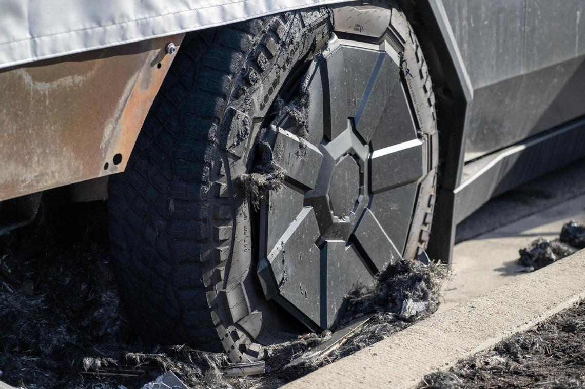A scorched tire from a burned Tesla Cybertruck is seen at the State Line Tesla dealership on March 18 in Kansas City.