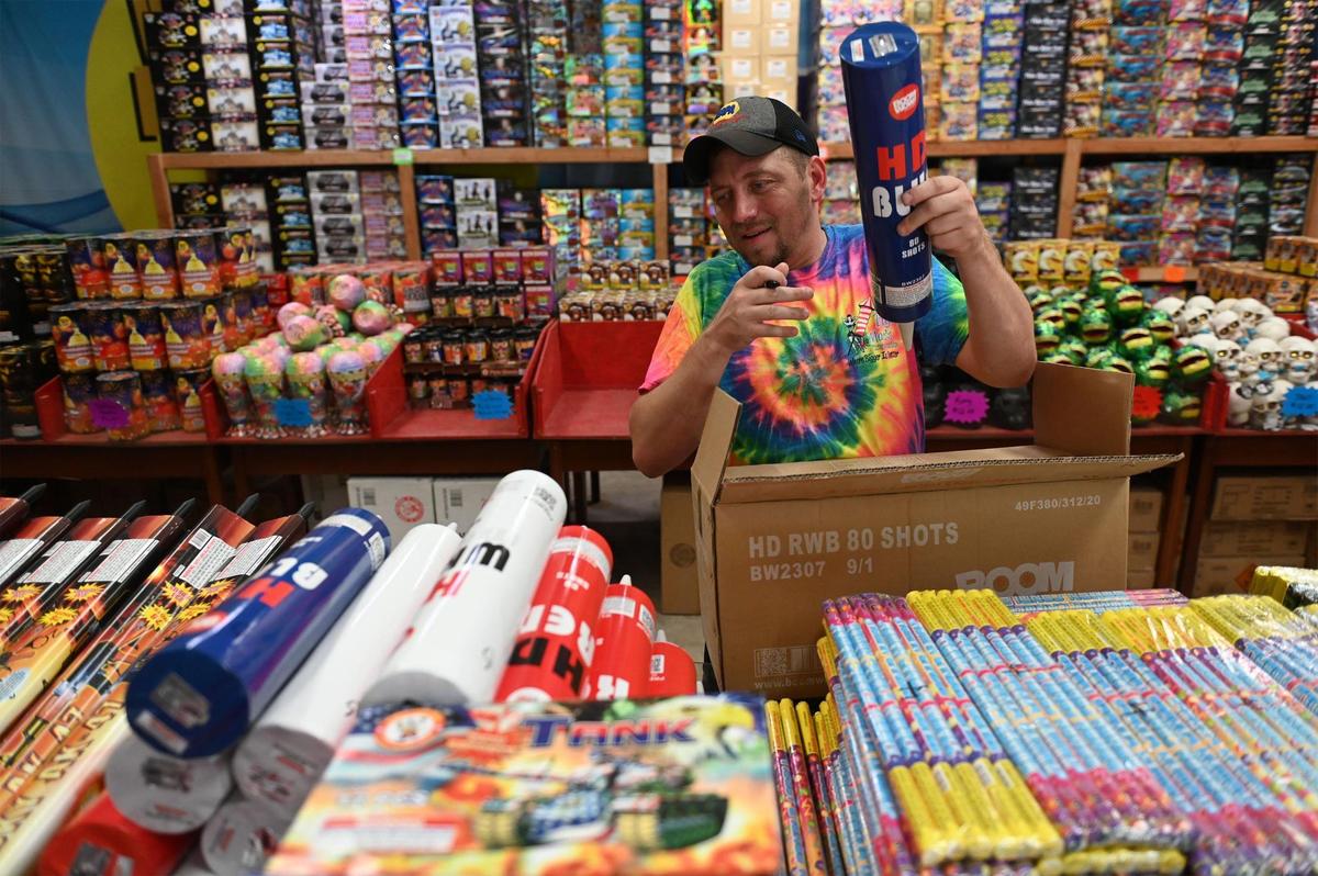 In anticipation of the Fourth of July weekend, Derick Martin unboxed inventory of sparklers, mortar shells and other fireworks Wednesday at Big Mac’s Fireworks, 1605 Marsh Ave., in unincorporated Jackson County. Gene McClung, owner of Big Mac’s Fireworks, ordered 10 containers of fireworks and by the time he was ready to open his tent, he had only received three. He supplemented what was missing through wholesalers, but he’s still running short of the demand. McClung anticipated a sellout this season.