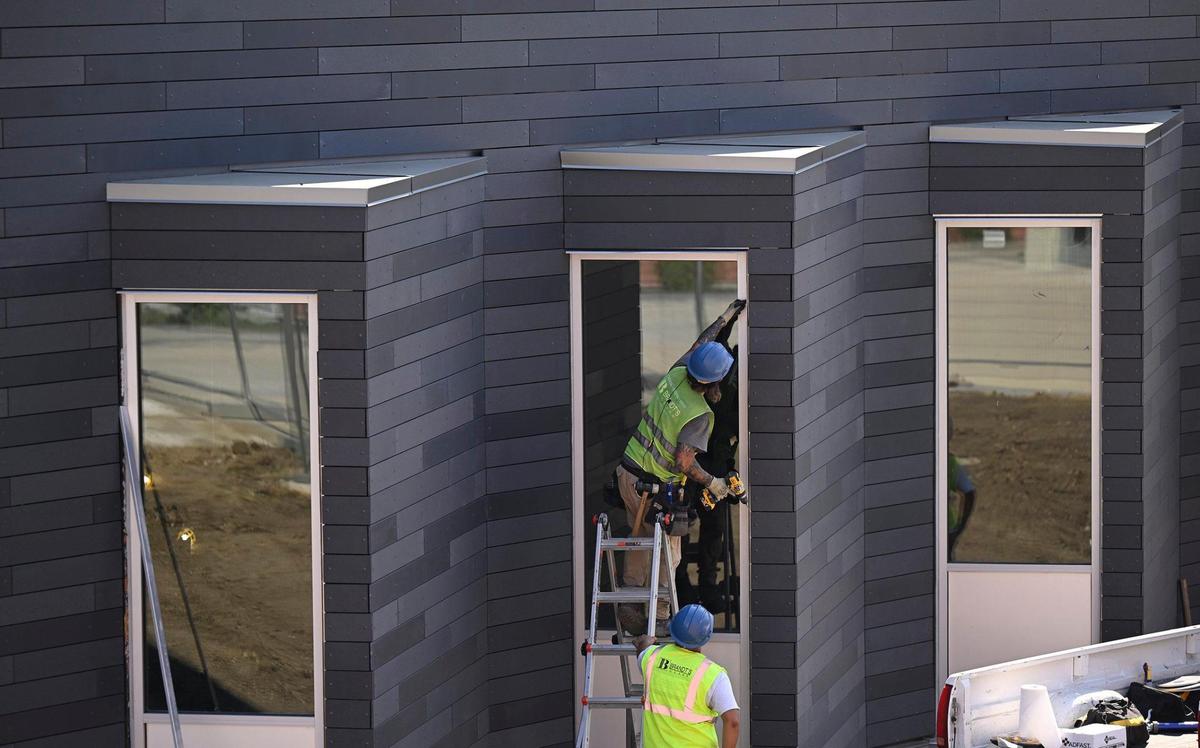 Work was ongoing at the Merriam Plaza Library on Friday, Sept. 29, 2023, where the building exterior was covered in a low-maintenance öko skin concrete cladding. The slat-size panels can be individually replaced if damaged.