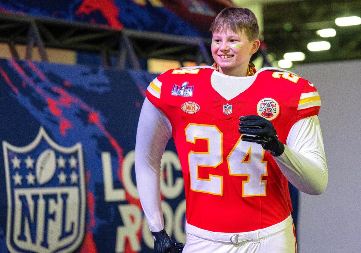 Kansas City Chiefs fans Hudson Munsterman, 9, of Lake Waukomis, near Kansas City, took in the Super Bowl Experience with his father, Chris Munsterman,on Thursday, Feb. 8, 2024, in Las Vegas, Nevada.