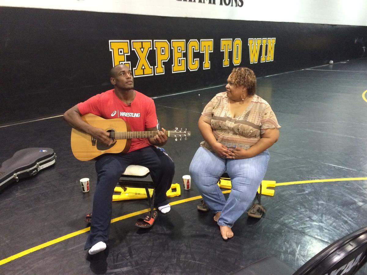 The two sides of J’den Cox, left, were on display as the Olympics wrestler and Mizzou grad sang for his mom in Columbia.