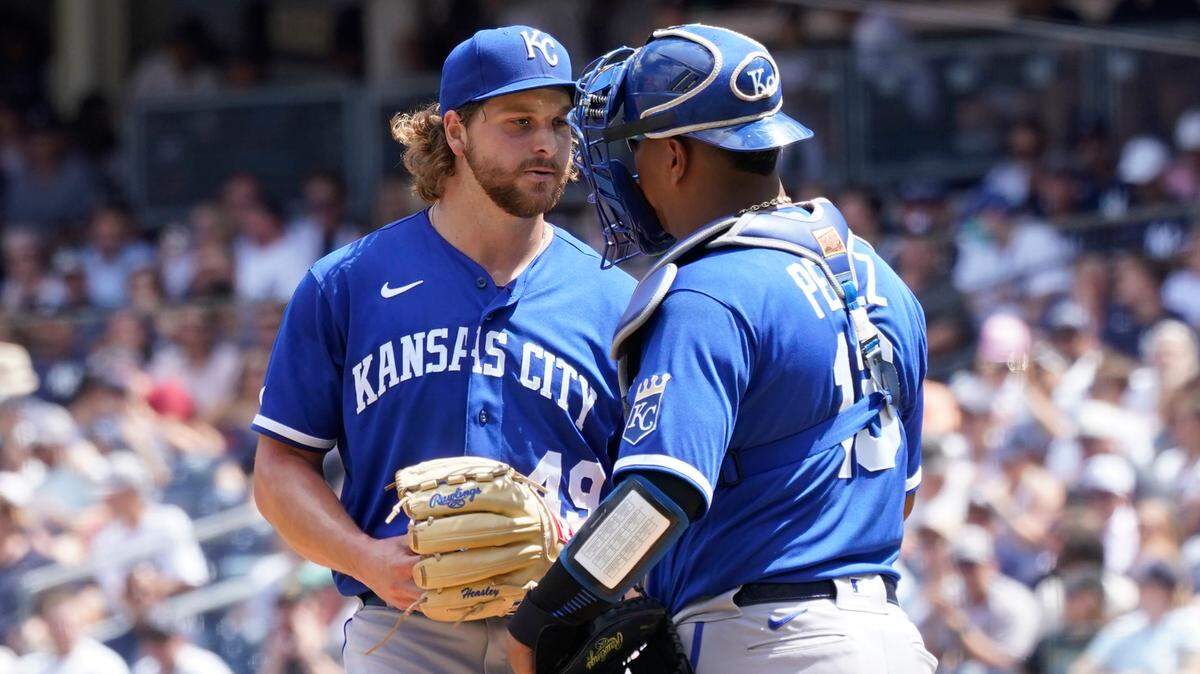 Kansas City Royals pitcher Jonathan Heasley (49) has a mound conference with catcher Salvador Perez, right, during the first inning of a baseball game against the New York Yankees, Saturday, July 30, 2022, in New York. (AP Photo/Mary Altaffer)