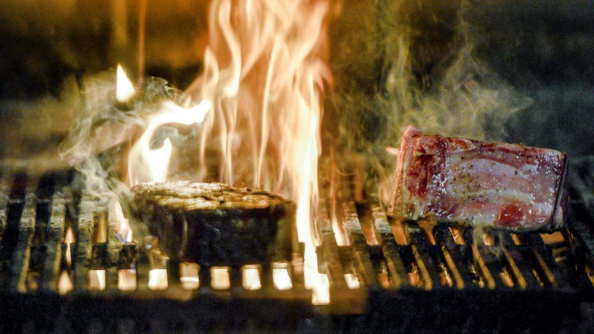 At Stock Hill in the former Board of Trade building, now called 4800 Main, steaks are cooked over a wood-burning stove.