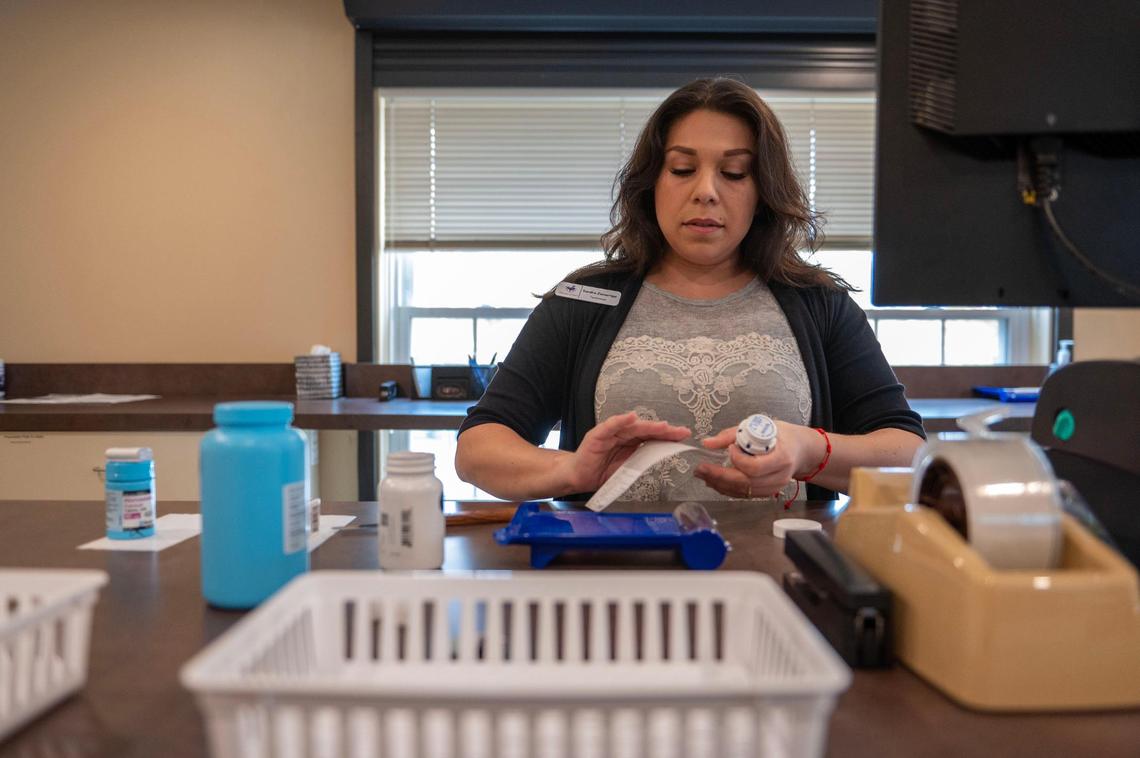 Pharmacy technician Sandra Zamarripa is one of three pharmacy employees. Pharmacy founder John Yost also would like to have pharmacy students from the University of Missouri-Kansas City and the University of Kansas work there in the future.