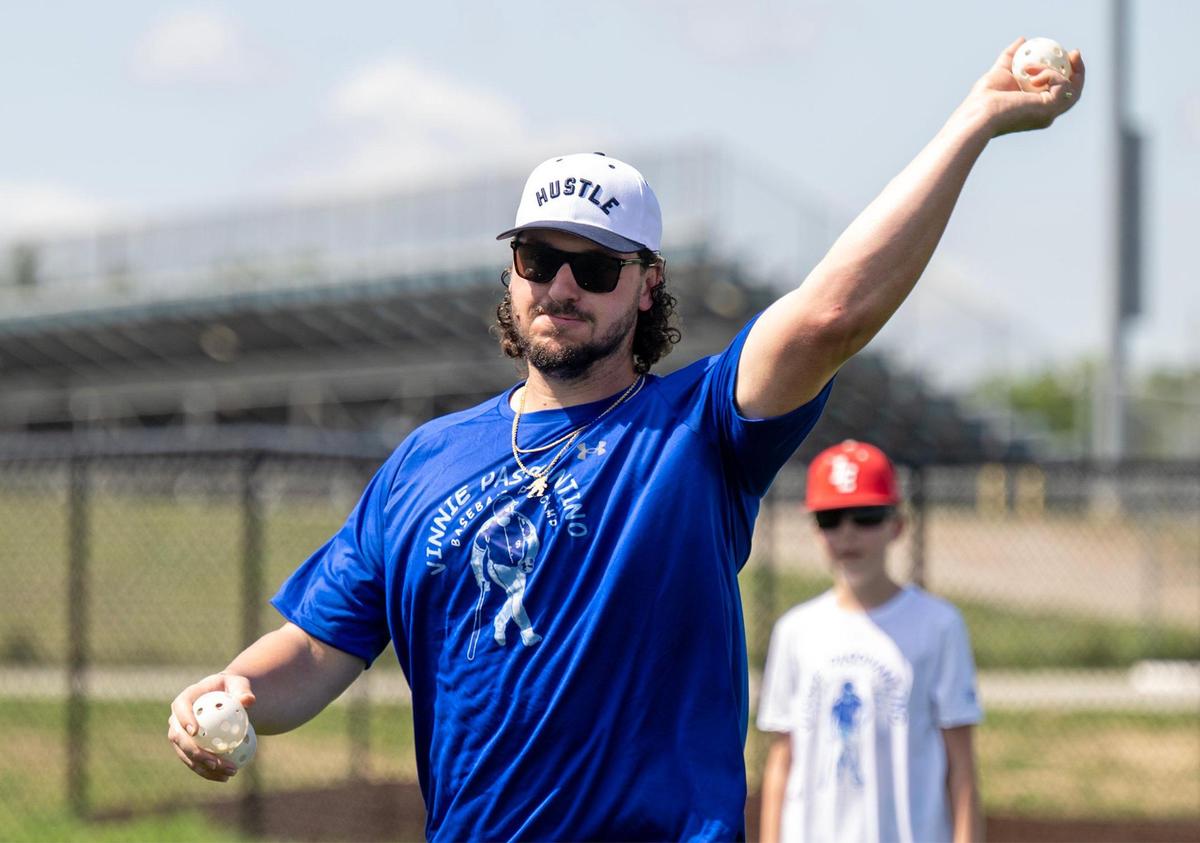 Kansas City Royals first baseman Vinnie Pasquantino throws whiffle balls for batting practice during the Vinnie Pasquantino Baseball ProCamp at Grandview High School on Thursday, July 10, 2025, in Grandview, Missouri.