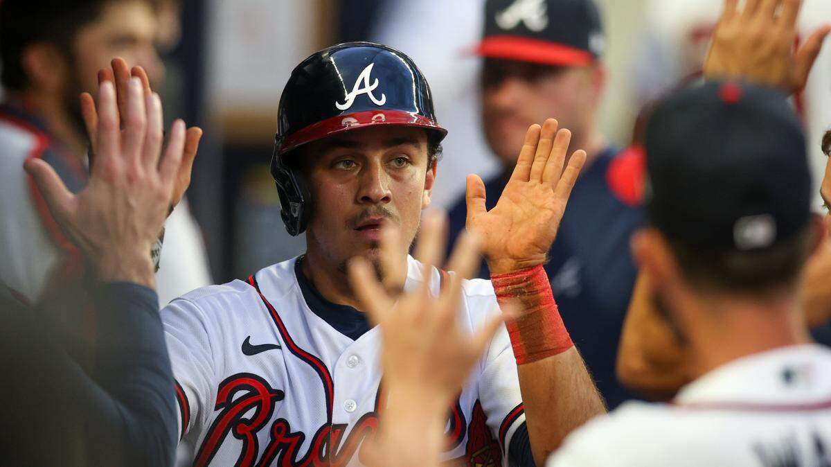 Aug 14, 2023; Atlanta, Georgia, USA; Atlanta Braves second baseman Nicky Lopez (15) celebrates with teammates after scoring a run against the New York Yankees in the second inning at Truist Park. Mandatory Credit: Brett Davis-USA TODAY Sports