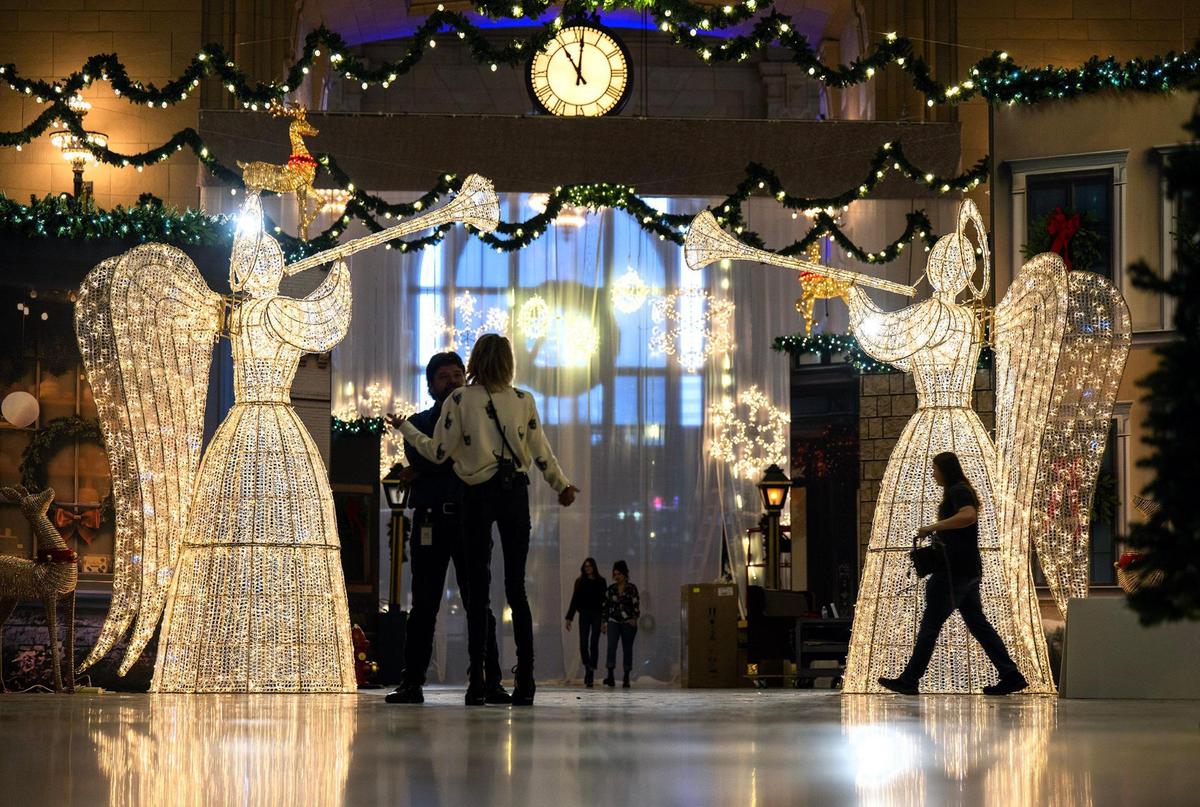 Crews work to set up the Holiday Reflections display in Union Station’s Grand Plaza.