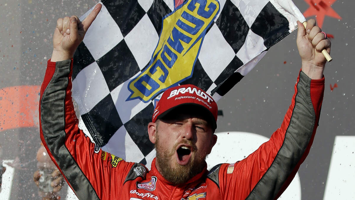 Justin Allgaier celebrates with his crew in victory lane after winning last month’s Xfinity race at Chicagoland Speedway.