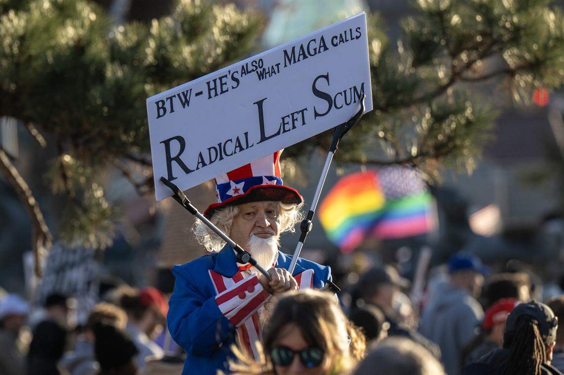 Demonstrators gather at the Mill Creek Park during a vigil for victims of U.S. Immigration and Customs Enforcement on Saturday, Jan. 10, 2026, in Kansas City.