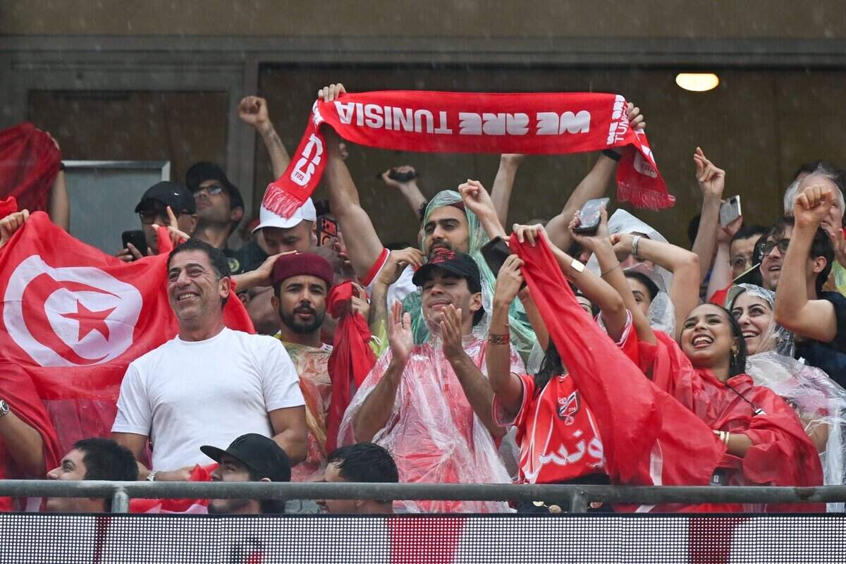Tunisian fans celebrate after the team scored their first goal of the match against the Netherlands in the FIFA World Cup group-stage soccer match at Kansas City (Arrowhead) Stadium in Kansas City on Thursday, June 25, 2026.