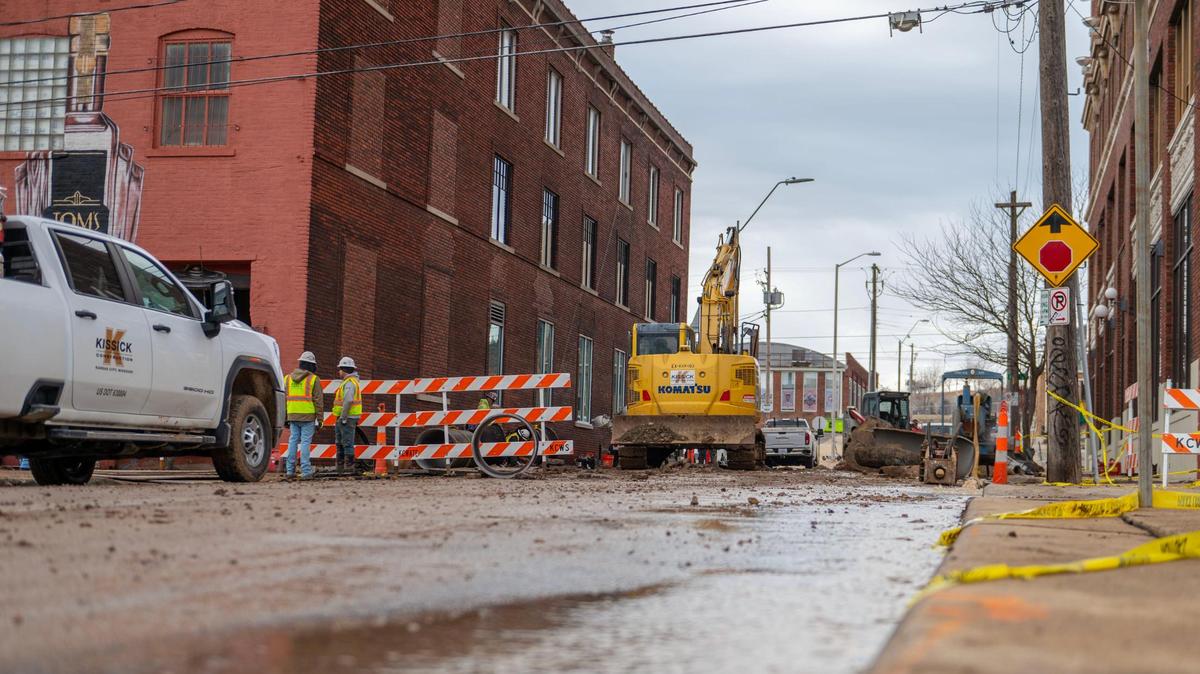 Crew members from Kissick Construction work to repair a 30-inch water main break on Saturday, Dec. 31, 2022, in Kansas City. The main broke Friday night near the corner of Walnut Street and East 17th Street when a vehicle struck a fire hydrant.