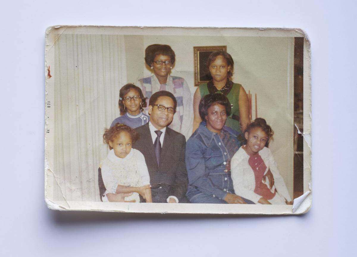 Robert Braynham (middle left) smiles for a photo with his wife, Joanna Braynham, and his five daughters. He was the pastor at Metropolitan Baptist Church in Kansas City for the last 40 years, known for his philosophical sermons and his commitment to service.