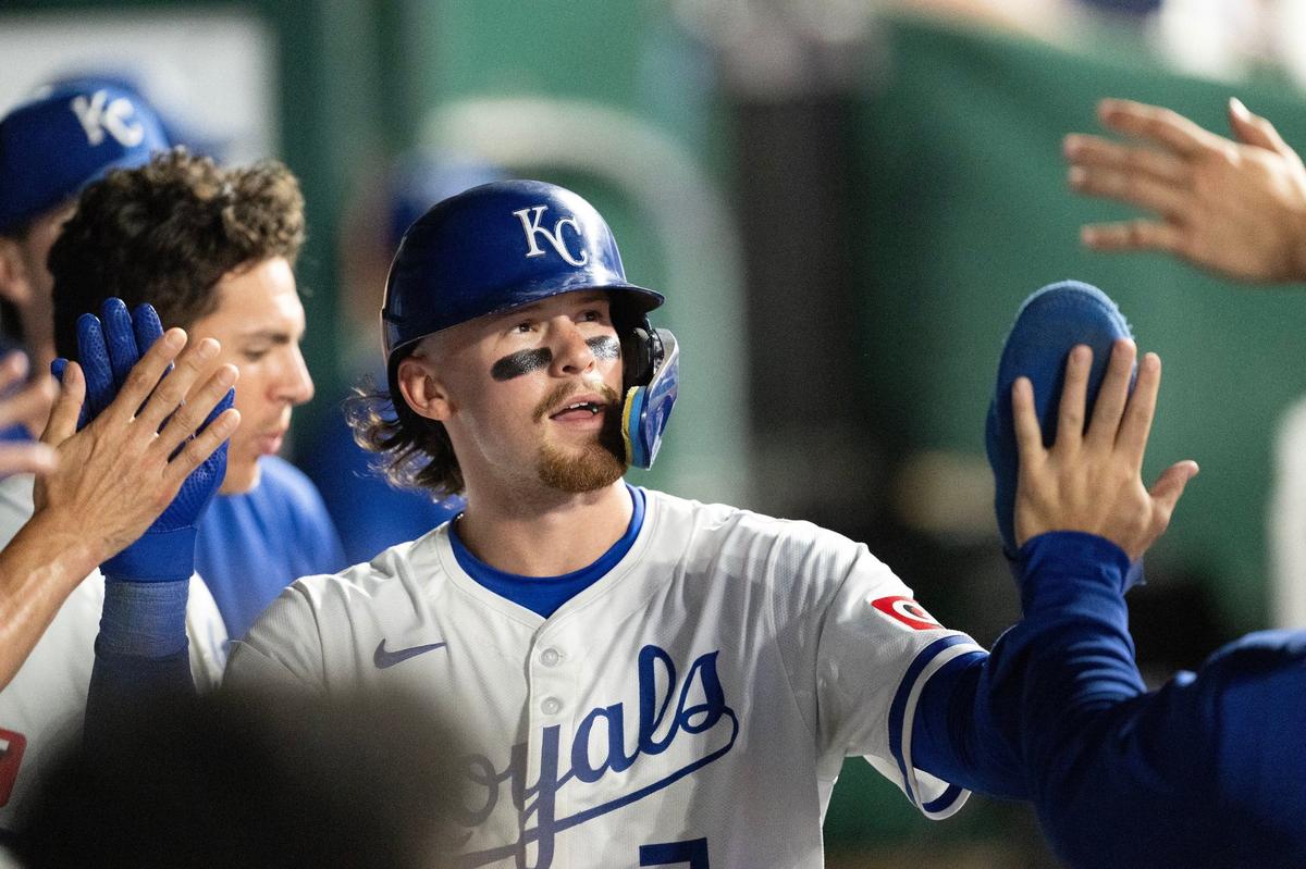 Kansas City Royals shortstop Bobby Witt Jr. (7) gets high-fives from his teammates after scoring on a wild pitch in the bottom of the seventh inning against the New York Yankees on Wednesday, June 12, 2024, at Kauffman Stadium.