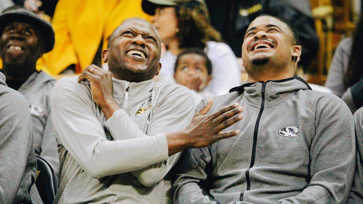 Missouri head coach Dennis Gates laughs with Tigers guard Nick Honor during Missouri’s NCAA Selection Show watch party on March 12, 2023 at Mizzou Arena.