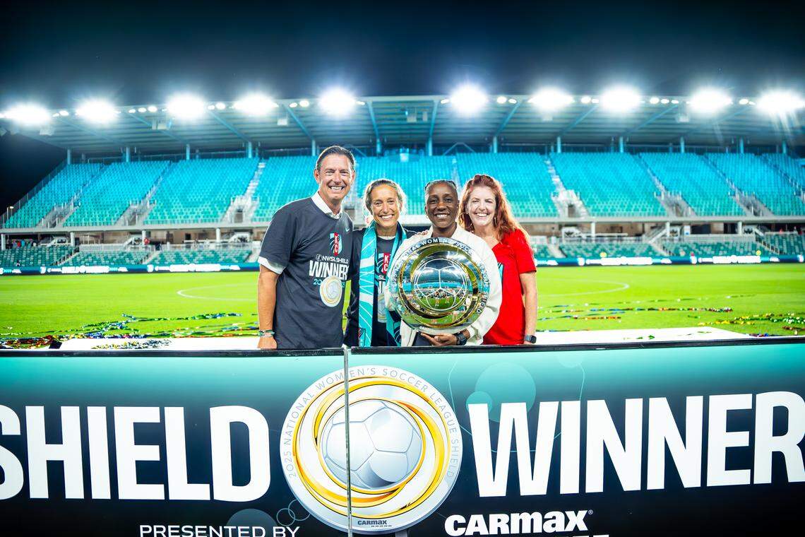 KC Current co-owners Chris and Angie Long, president Raven Jemison, and Jemison’s wife, April Biggs, celebrate the Current winning the 2025 NWSL Shield.
