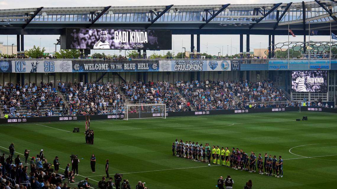 Sporting Kansas City and New England Revolution players at Children’s Mercy Park observe a moment of silence for former KC player Gadi Kinda on May 24, 2025. Kinda recently passed away at age 31.